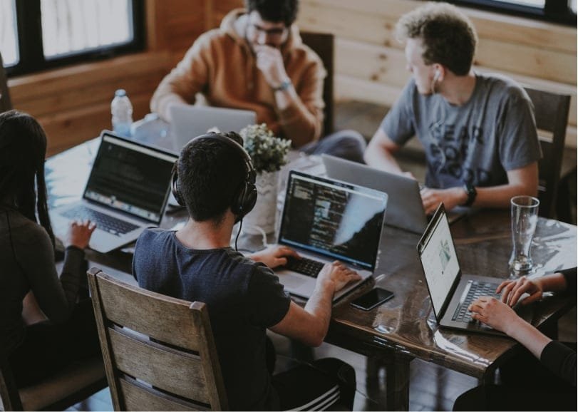 Employees working in their computers for the growth of startup business